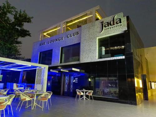 a building with chairs and tables in front of it at Jada Lifestyle & Lounge in Lagos