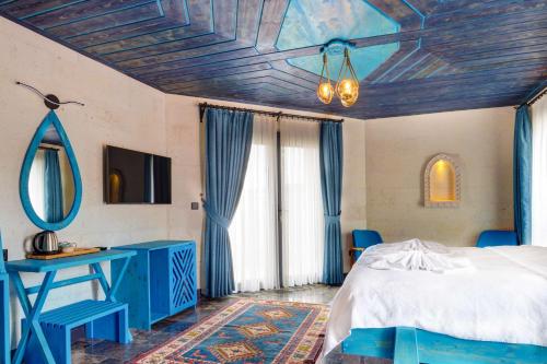 Postel nebo postele na pokoji v ubytování Motif Art Cappadocia