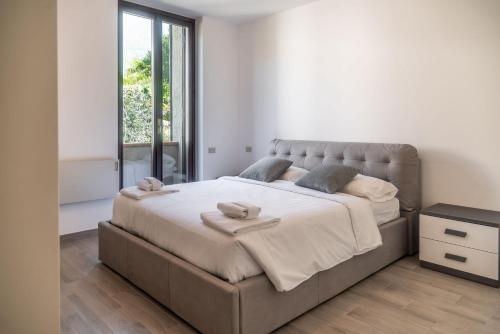 Ένα ή περισσότερα κρεβάτια σε δωμάτιο στο Casa Balbianella - Lenno by LoveComo
