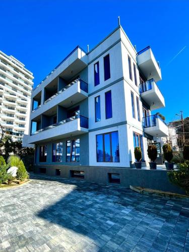 a large white building with a lot of windows at Queen Tamar in Batumi