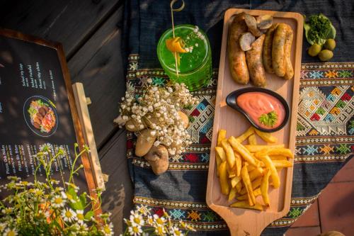 a table with a tray of food and french fries at Deja Vu House Ha Long in Ha Long
