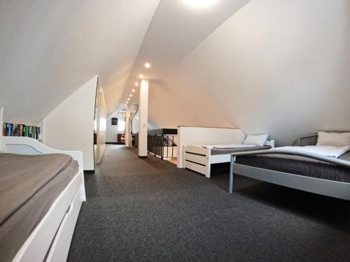 a large room with two beds and a couch at Ferienwohnung im Allgäu in Durach