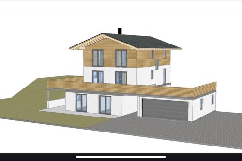 eine Zeichnung eines Hauses mit Garage in der Unterkunft Ferienwohnung Haslach in Wertach