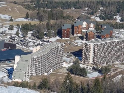 an aerial view of a large apartment building at chalet gentiane cosy T2 labellisé Dévoluy in Superdevoluy