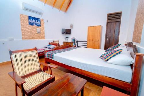 Postel nebo postele na pokoji v ubytování Passi Nature Villas Passikudah