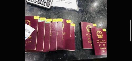 a group of books on a table next to a calculator at KHÁCH SẠN HOÀNG TRIỀU in Chánh Long