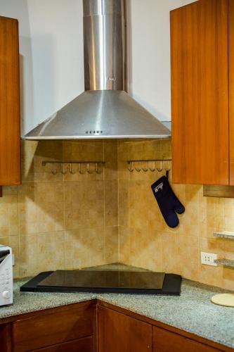 a hood over a stove in a kitchen at ไอทะเล พูลล่า หัวหิน I-Talay Poolvilla huahin in Hua Hin