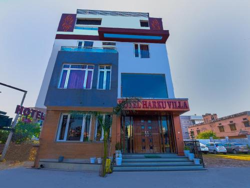 a building with a sign on the front of it at Hotel Harku Villa in Dabok