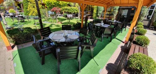 an overhead view of a patio with tables and chairs at Eko Hotel Na Wierzynka & Park Pinokia in Wieliczka