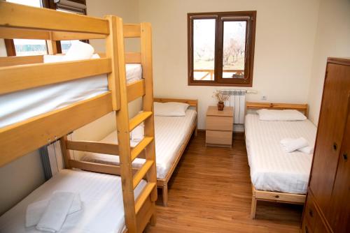 a room with two bunk beds and a window at EcoLodge in Wildlife Refuge in Urtsʼadzor