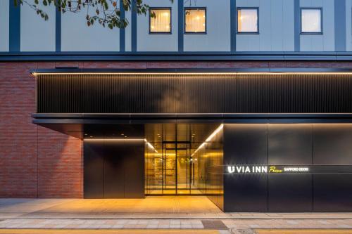 an entrance to a building with a sign on the door at Via Inn Prime Sapporo Odori in Sapporo