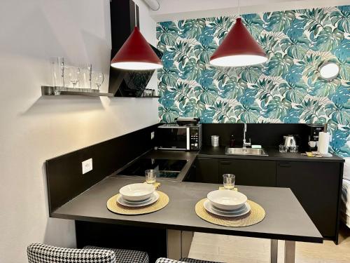 Een keuken of kitchenette bij [DUOMO-Linate-Istituto dei Tumori] Suite WiFi