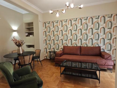 a living room with a couch and a table at Caravin Wanderhome Acropolis, 1 min from Acropolis Museum in Athens