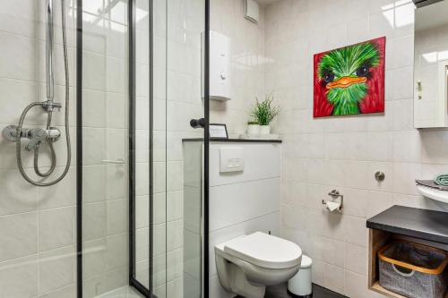 a bathroom with a shower and a toilet and a sink at Haus Frigger in Olsberg