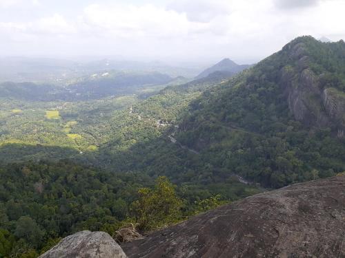a view of a valley from the top of a mountain at Alagalla Terrace in Kadugannawa