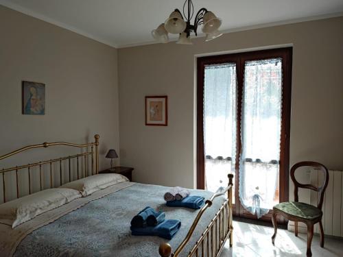 a bedroom with a bed with two towels on it at Come a casa in Monsummano