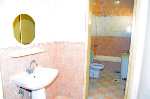 a bathroom with a sink and a toilet at درة 1 in Al Jubail