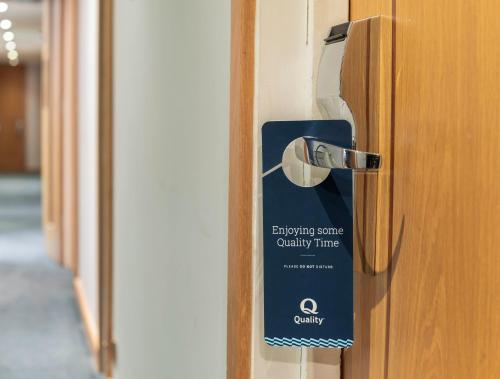 a door with a entry sign on it at Quality Hotel Hampstead in London
