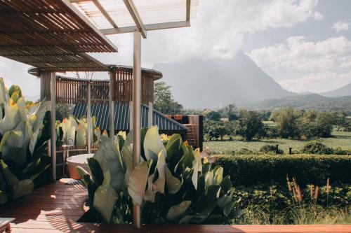 a patio with a view of a mountain at The CAMPIAN in Chiang Mai
