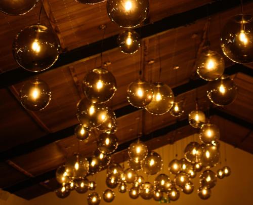 a bunch of lights hanging from a ceiling at The Barnsdale, Rutland in Oakham