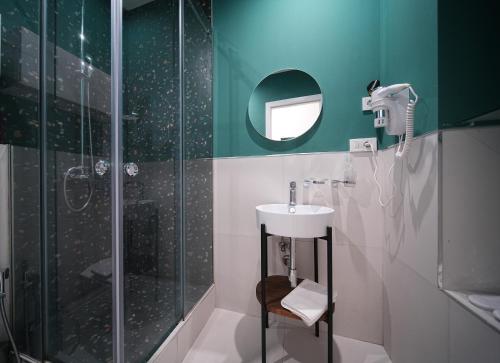 a bathroom with a sink and a shower at Sweet Home Apart-Hotel in Yerevan