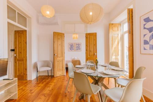 a dining room with a table and chairs at RENT4REST CASTLE VIEW FAMILY & FRIENDS Bairro Alto in Lisbon