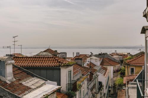 an overhead view of a city with roofs at RENT4REST CASTLE VIEW FAMILY & FRIENDS Bairro Alto in Lisbon