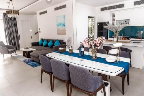 a living room with a couch and a table at 2 BRs villa with private pool ( Villa 2 PN hồ bơi riêng) in Dien Khanh