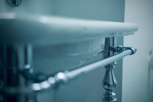 a close up of a mirror in a bathroom at Plesners Badehotel in Skagen