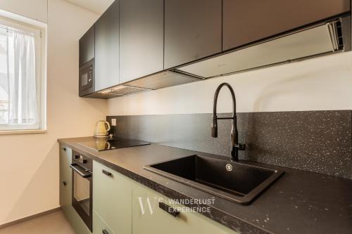 Kuchyň nebo kuchyňský kout v ubytování Wanderlust Experience Mood Apartment