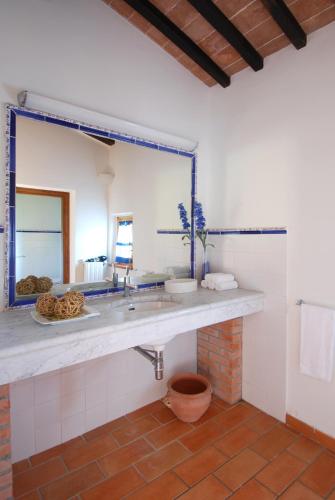 a bathroom with a sink and a mirror at Agriturismo Raccianello in San Gimignano