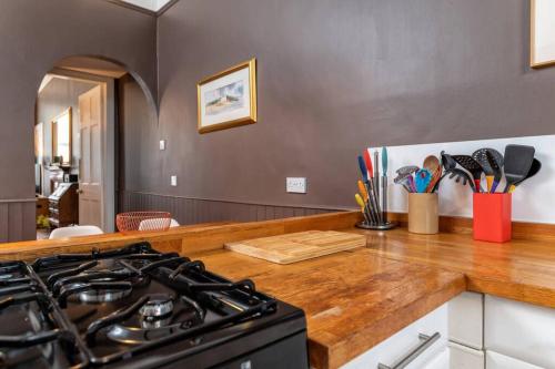 a kitchen with a stove and a counter top at 6 Howard Place in St. Andrews