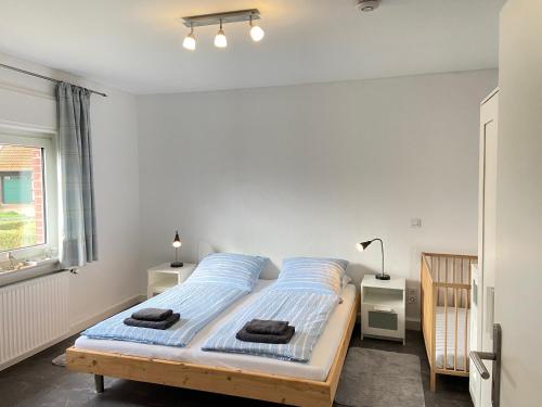 Кровать или кровати в номере Schwalbennest Ferienvermietung Arendholz