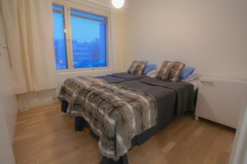 Ένα ή περισσότερα κρεβάτια σε δωμάτιο στο Newly Built Rovakatu 11 Center Apartment with 2 Bedrooms, sleeps 6