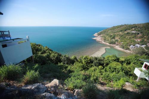 a view of a beach from a hill at Phangan Utopia Resort in Mae Haad