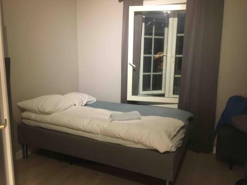 A bed or beds in a room at Studio Apartments Oslo Airport