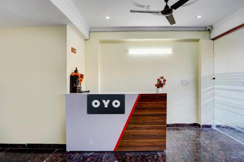 an office lobby with an ovo sign on the wall at OYO YUVRAJ RESIDENCY in Noida