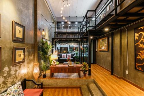 a room with a table in the middle of a building at Cozy@25 in Chiang Mai