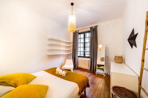 En eller flere senge i et værelse på Le Jacobins/Apartment 4 People AIL