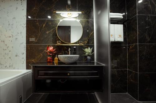 a bathroom with a sink and a mirror at Dolce Mia Home Ninh Bình in Ninh Binh