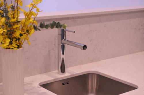 a kitchen sink with a faucet on a counter at Spires studio in Dublin