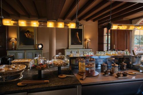 a kitchen with a buffet of food on a counter at Hotel Valldemossa - New Opening 2024 in Valldemossa