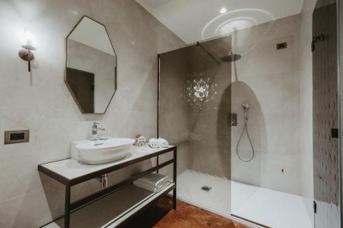 a bathroom with a sink and a shower at Hotel Giorgione in Venice