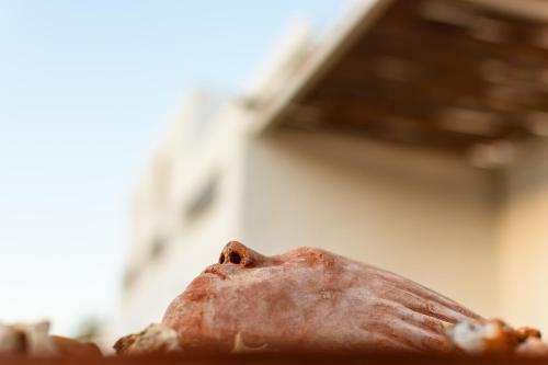 a close up of a piece of food on a table at Elounda Island Villas in Elounda