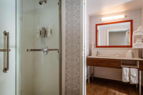 a bathroom with a shower and a sink at Hampton Inn & Suites St. Louis-Chesterfield in Chesterfield