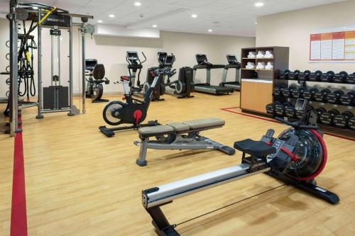 a gym with several treadmills and exercise bikes at DoubleTree by Hilton Hotel Burlington Vermont in Burlington