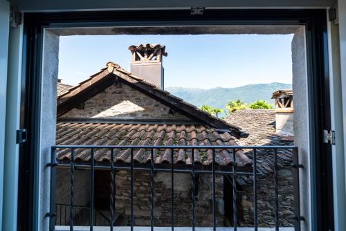 a window view of a house with a roof at Villa Sophia in Gerra