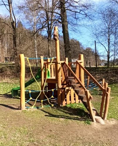 a playground in a park with a slide at Apartmán STŘEVLIK Oldřichov v Hájích in Oldřichov v Hájích