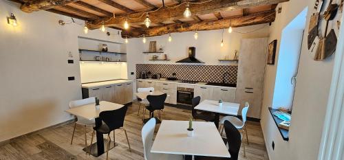 a restaurant with tables and chairs in a room at Il Gaudente B&B in Santa Fiora