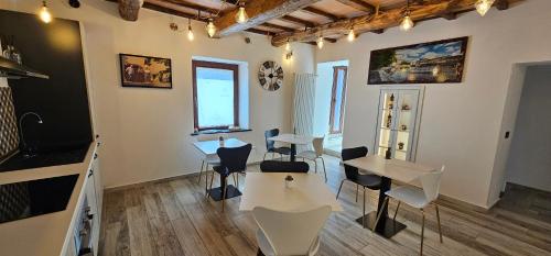 a room with tables and chairs in a room at Il Gaudente B&B in Santa Fiora